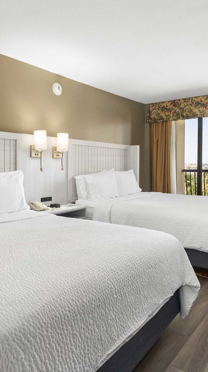 Two queen beds with private balcony